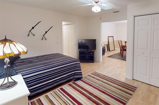 bedroom featuring light hardwood / wood-style floors and ceiling fan