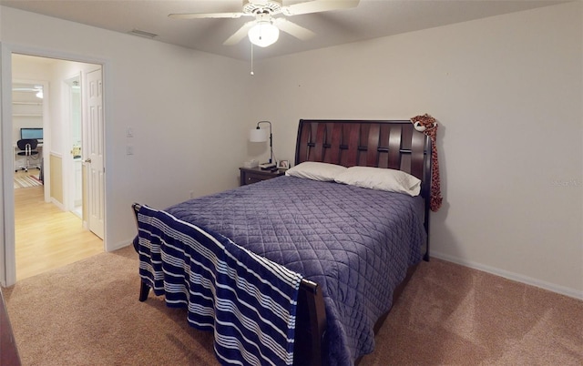 carpeted bedroom with ceiling fan