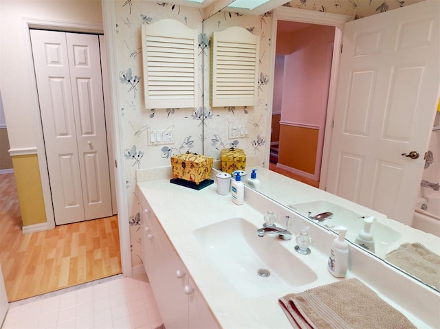 bathroom featuring vanity and wood-type flooring