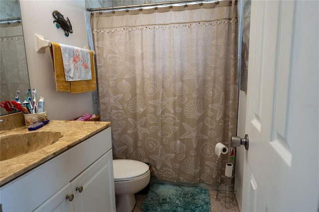 bathroom featuring vanity, toilet, tile patterned floors, and walk in shower