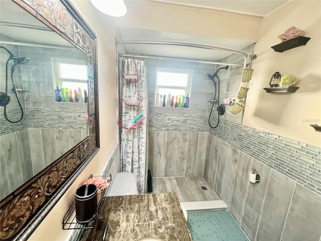 bathroom with a shower with shower curtain and plenty of natural light