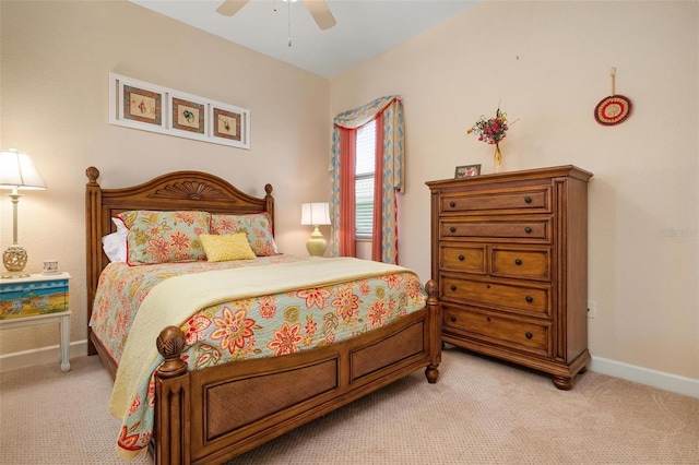 bedroom featuring light colored carpet and ceiling fan