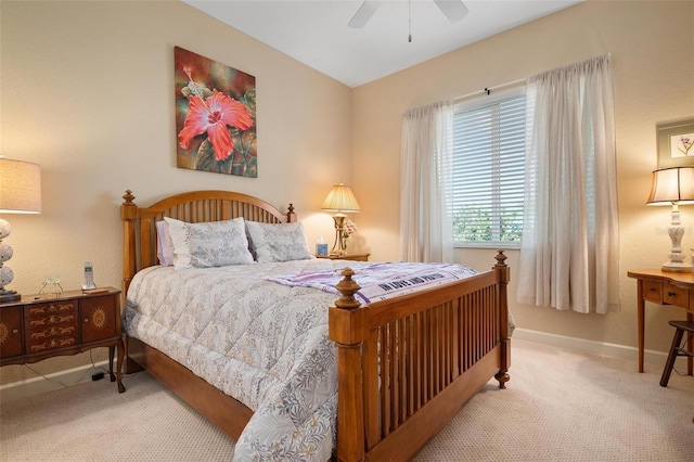 bedroom featuring light carpet and ceiling fan