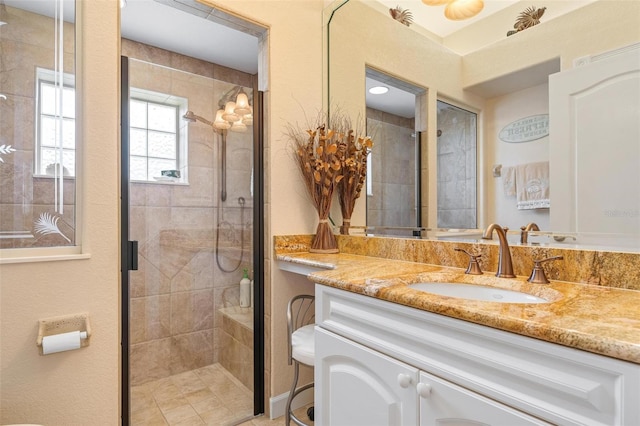 bathroom with vanity and walk in shower