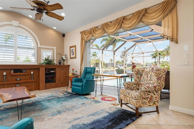 sitting room with ceiling fan and light tile patterned flooring