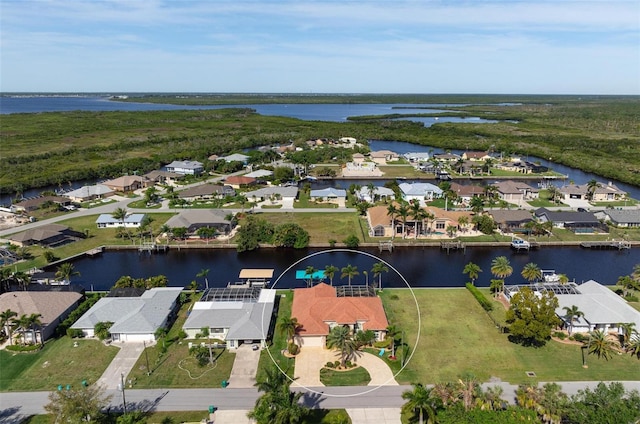 birds eye view of property featuring a water view