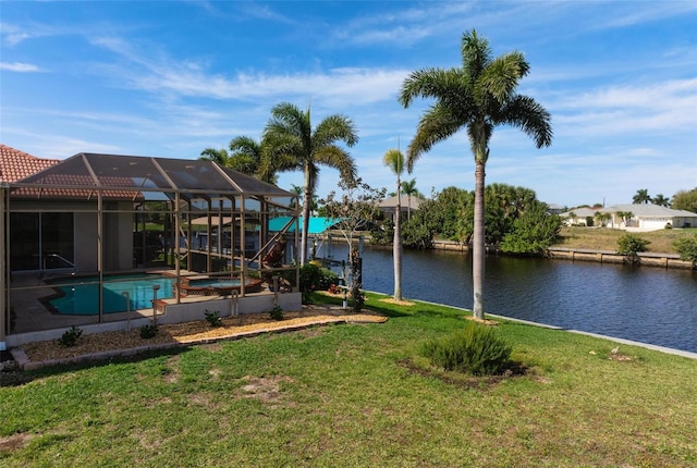 dock area featuring a lawn, a water view, and glass enclosure