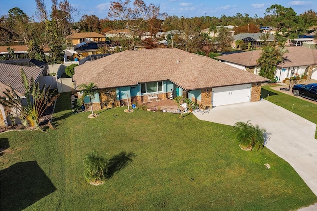 ranch-style home with a front yard and a garage