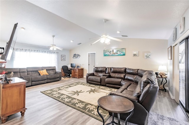 living room with vaulted ceiling, light wood-type flooring, and ceiling fan