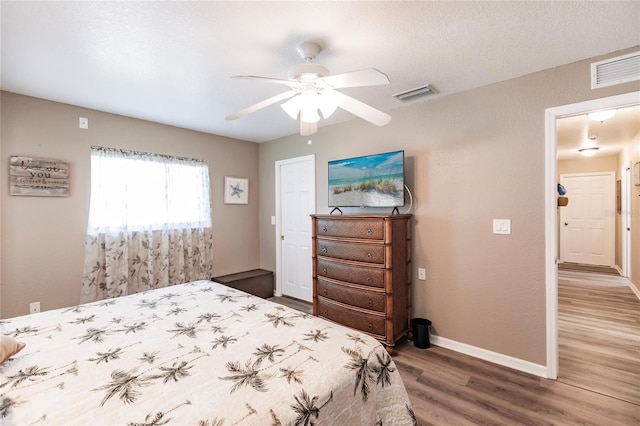 bedroom featuring hardwood / wood-style floors and ceiling fan