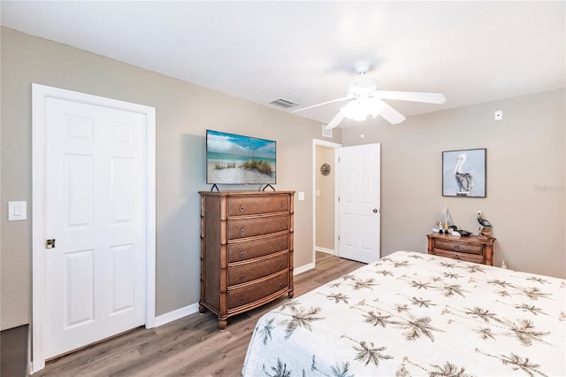 bedroom with hardwood / wood-style flooring and ceiling fan