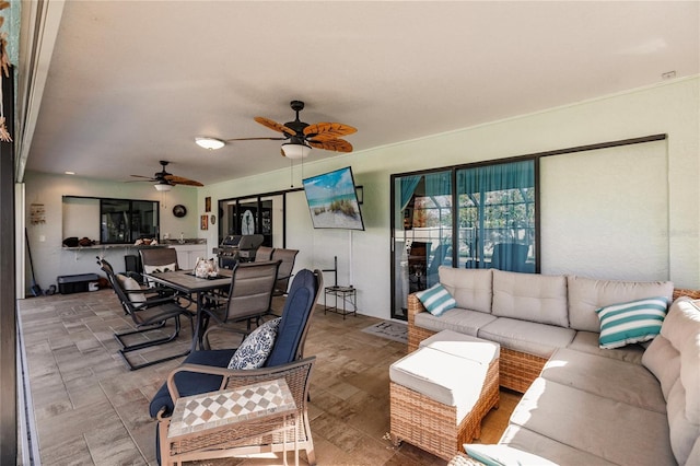 view of patio with outdoor lounge area and ceiling fan