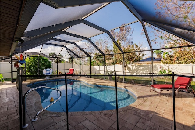 view of pool featuring a patio area and a lanai