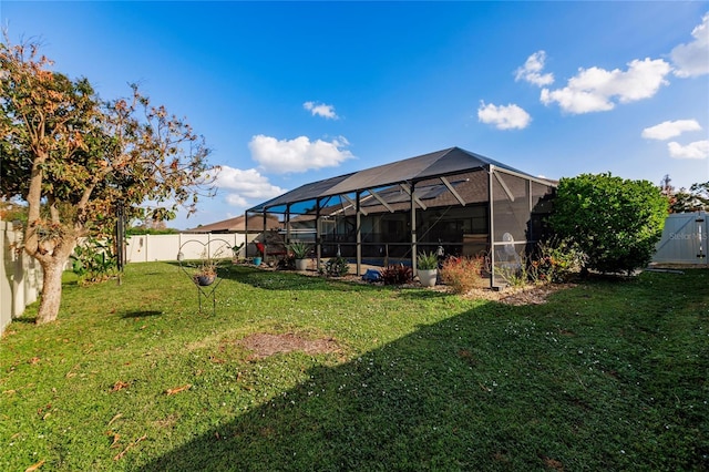 view of yard featuring glass enclosure