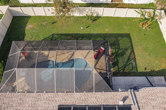 view of basketball court featuring a fenced in pool and a yard