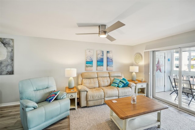 living room featuring hardwood / wood-style flooring and ceiling fan