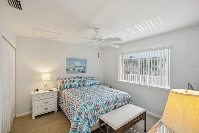 carpeted bedroom featuring a closet and ceiling fan