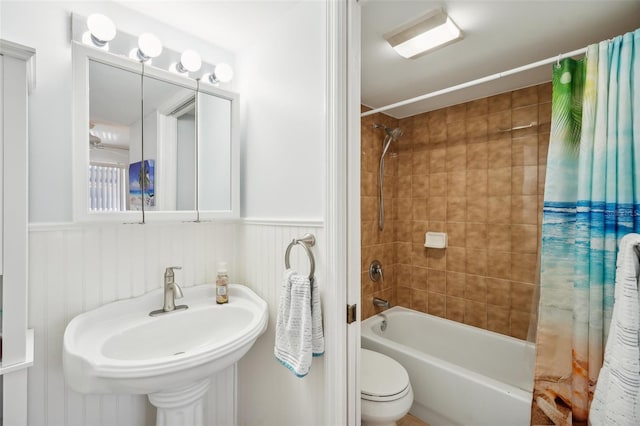 full bathroom featuring toilet, sink, and shower / bath combo