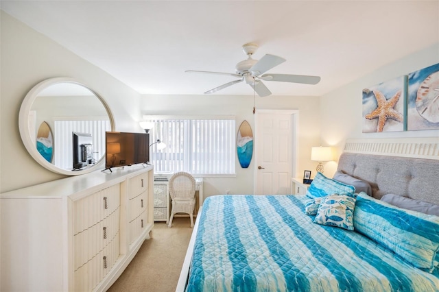 carpeted bedroom featuring ceiling fan