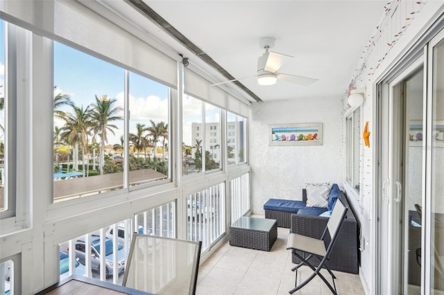 sunroom with ceiling fan and a healthy amount of sunlight