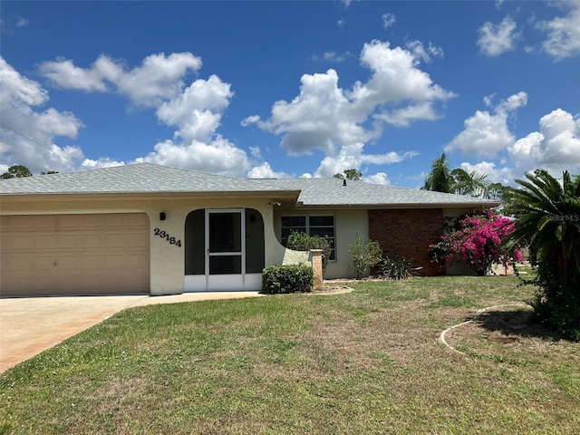 single story home with a front lawn and a garage