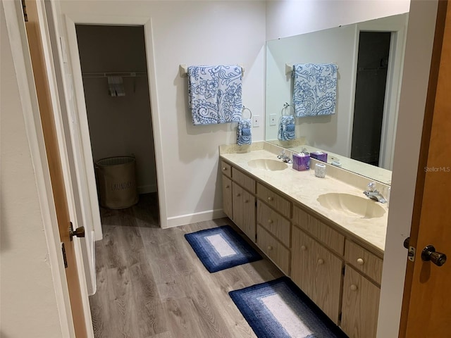 bathroom featuring vanity and hardwood / wood-style flooring