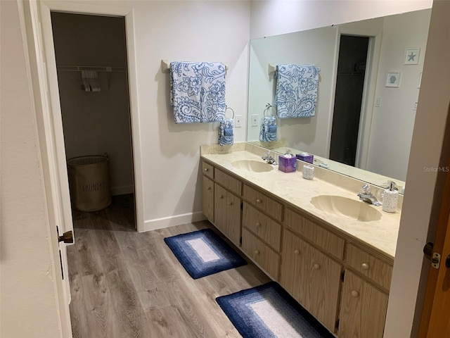 bathroom featuring vanity and hardwood / wood-style flooring