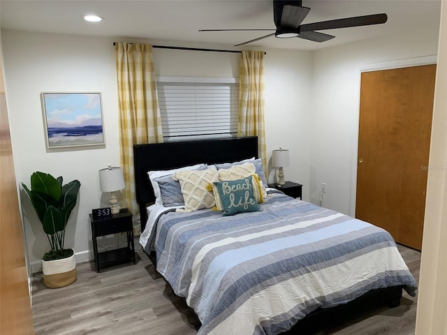 bedroom featuring hardwood / wood-style flooring and ceiling fan