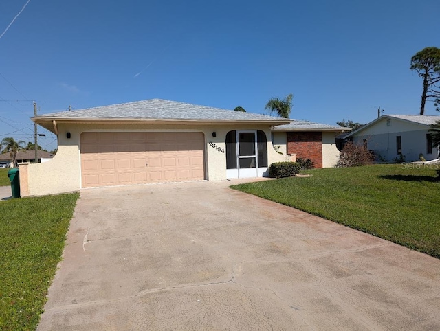 single story home with a front lawn and a garage