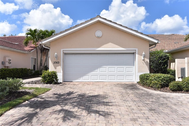 ranch-style home with a garage