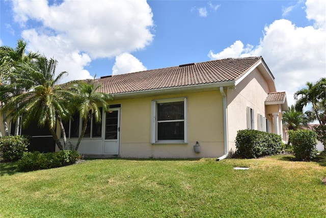 view of home's exterior featuring a lawn