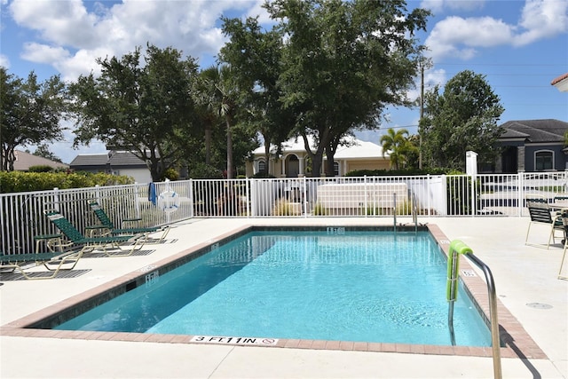 view of swimming pool featuring a patio area