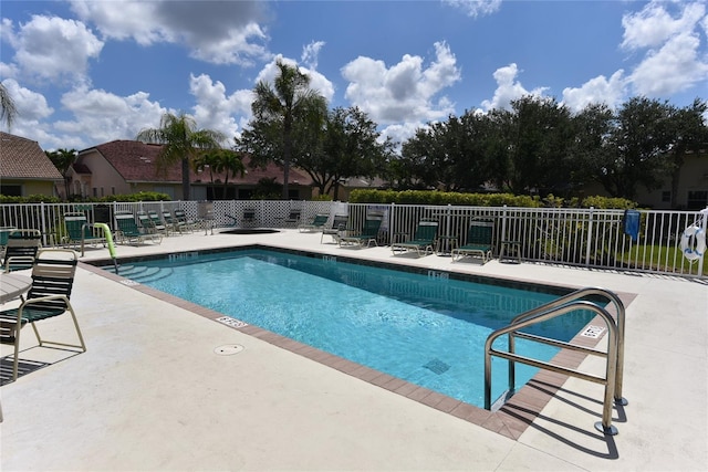 view of swimming pool featuring a patio area