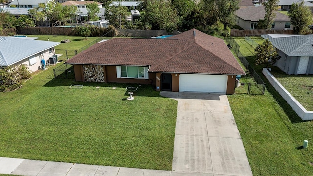 view of front facade with a garage and a front yard