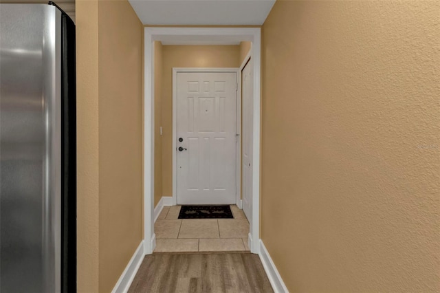 doorway to outside with light hardwood / wood-style flooring