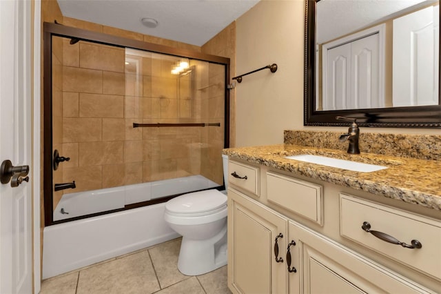 full bathroom featuring vanity, bath / shower combo with glass door, toilet, and tile patterned flooring