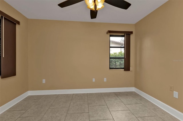 tiled empty room with ceiling fan