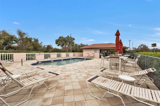 view of swimming pool with a patio area