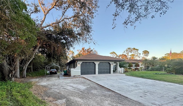 view of front facade with a front lawn and a garage