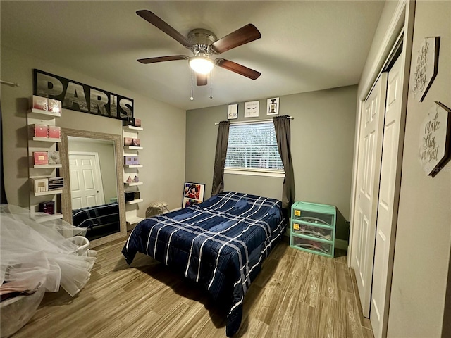 bedroom featuring light hardwood / wood-style flooring and ceiling fan