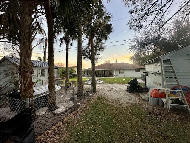 view of yard at dusk