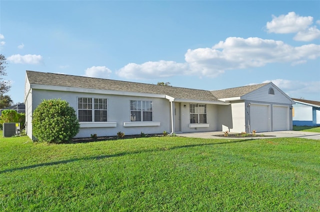 ranch-style home featuring a front lawn, central AC unit, and a garage