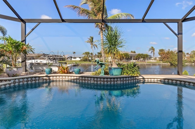 view of swimming pool featuring a water view and a lanai