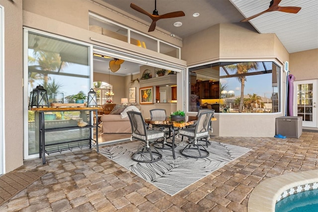 view of patio featuring ceiling fan