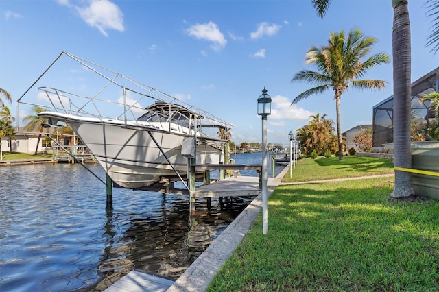 view of dock with a yard, a water view, and a lanai