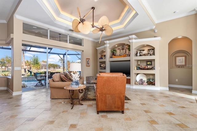 living room with crown molding, a notable chandelier, and built in features