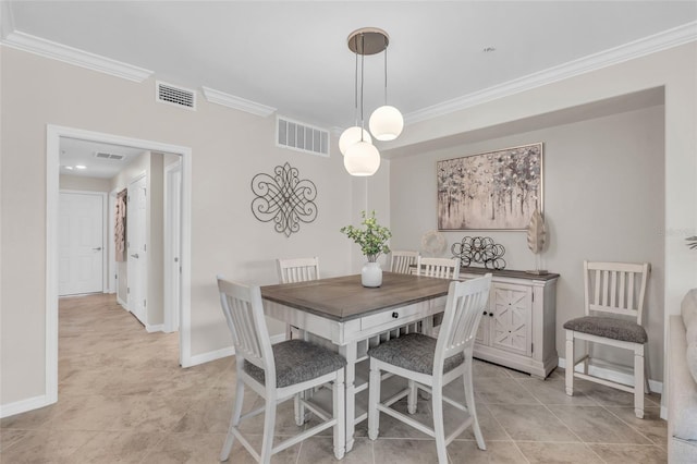 dining space with crown molding and light tile patterned flooring