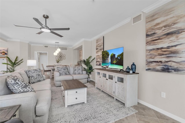 living room featuring crown molding, light tile patterned floors, and ceiling fan