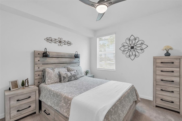 bedroom with light carpet and ceiling fan