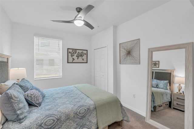 bedroom with a closet, ceiling fan, and carpet floors